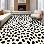 Minimalist Black Oval Speckled Cream Rug